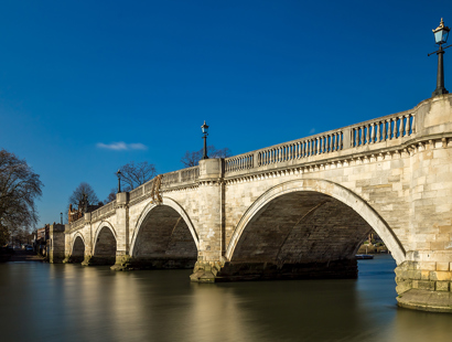 Richmond bridge and the Thames. Meeting room at solicitors office in Richmond for legal consultations.